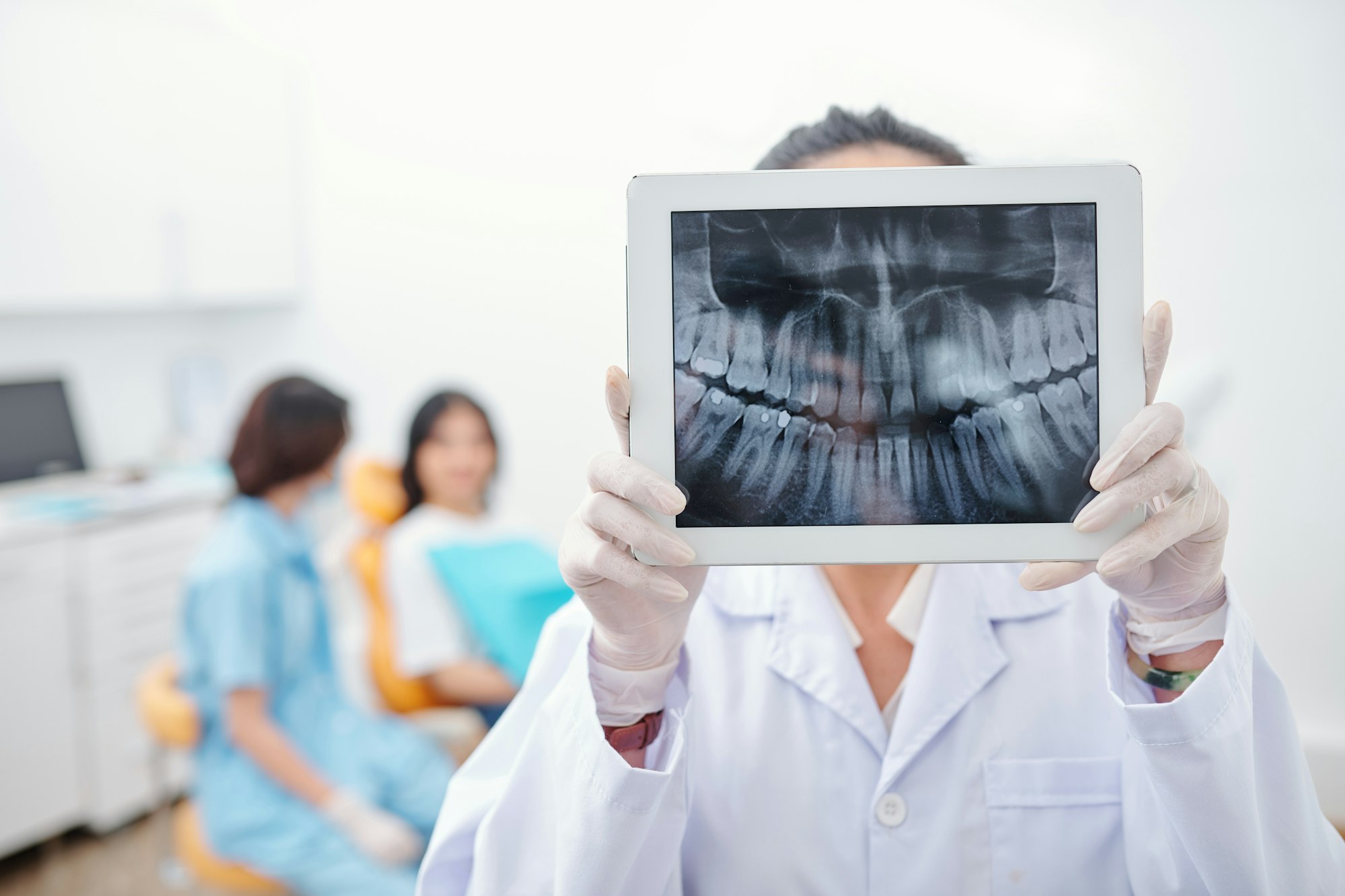 Dentist showng jaw x-ray
